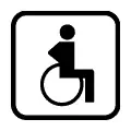 Pictograma vectorial minusválido en silla de ruedas. Señalización para rampas y accesos técnicos.